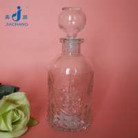 small round empty glass wine bottle with glass stopper for sale